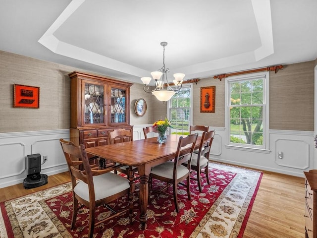 1 Benjamin Dr, Westborough, MA 01581 - dining space featuring a chandelier, wallpapered walls, wainscoting, a raised ceiling, and light wood-type flooring