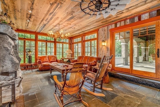 sunroom with track lighting, wood ceiling, and ceiling fan with notable chandelier