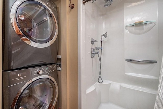 washroom with stacked washer / drying machine