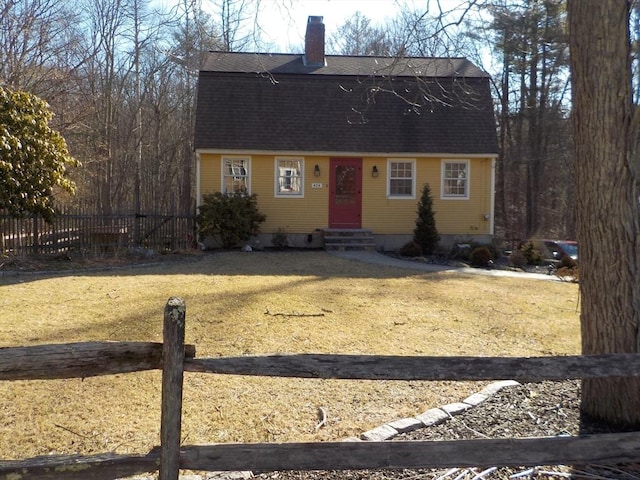 dutch colonial featuring a gambrel roof, entry steps, fence, roof with shingles, and a chimney