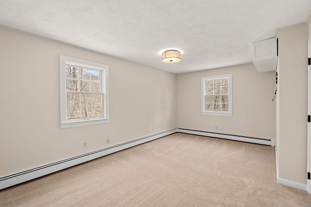 carpeted empty room with baseboards, baseboard heating, and a textured ceiling