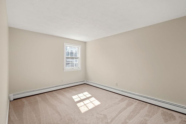 empty room with a baseboard heating unit and carpet floors