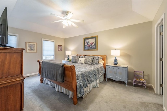 bedroom featuring baseboards, ceiling fan, and light colored carpet