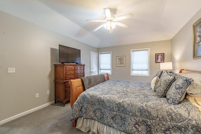 carpeted bedroom with vaulted ceiling, ceiling fan, and baseboards