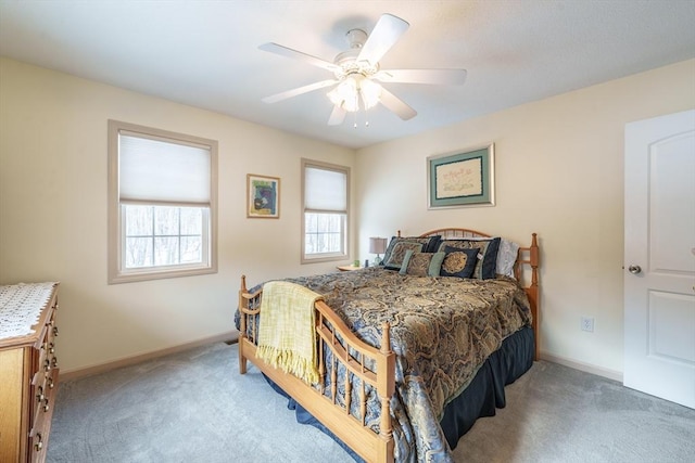 bedroom featuring ceiling fan, baseboards, and carpet flooring