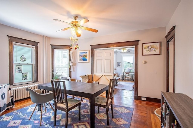 49-51 Fairmount Ave, Somerville, MA 02144 - dining space featuring radiator heating unit, a ceiling fan, plenty of natural light, and wood finished floors