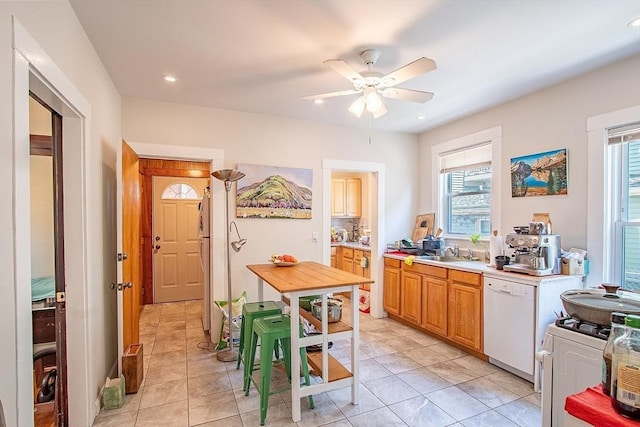 49-51 Fairmount Ave, Somerville, MA 02144 - kitchen with white appliances, a sink, a ceiling fan, light countertops, and light tile patterned floors