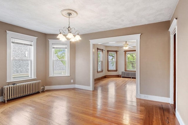 49-51 Fairmount Ave, Somerville, MA 02144 - unfurnished room with radiator, light wood-style floors, and healthy amount of natural light