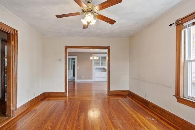 49-51 Fairmount Ave, Somerville, MA 02144 - spare room with hardwood / wood-style flooring, baseboards, a chandelier, and ceiling fan