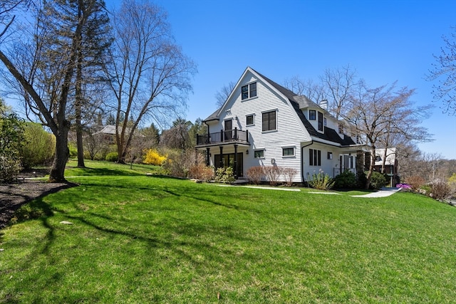 view of side of property with a yard