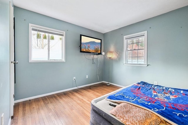 bedroom with hardwood / wood-style flooring