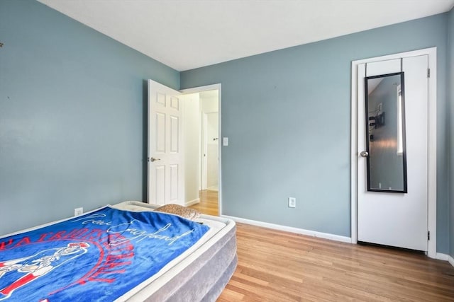 bedroom with wood-type flooring