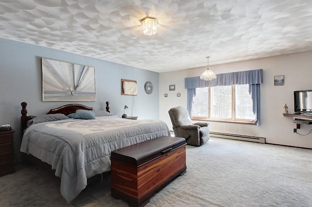 bedroom with a textured ceiling, baseboard heating, and carpet