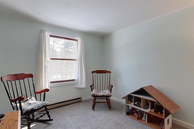 living area with carpet floors, a baseboard radiator, and baseboards