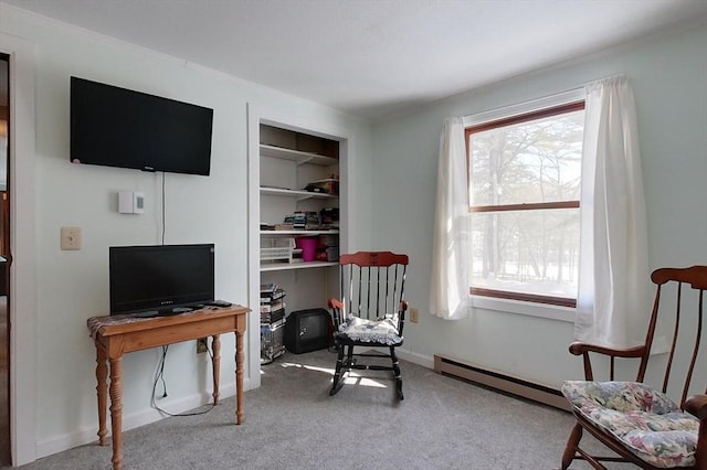 sitting room with a wealth of natural light, a baseboard radiator, carpet flooring, and baseboards