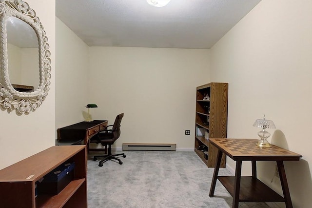 home office featuring light carpet, a baseboard radiator, and baseboards