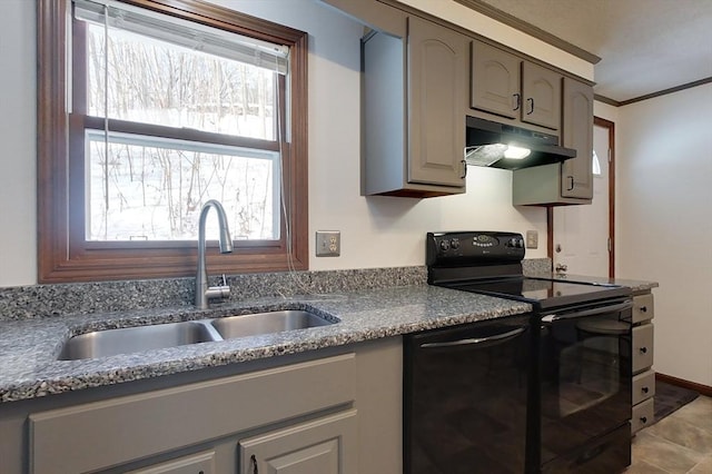 kitchen with gray cabinetry, under cabinet range hood, a sink, ornamental molding, and black appliances