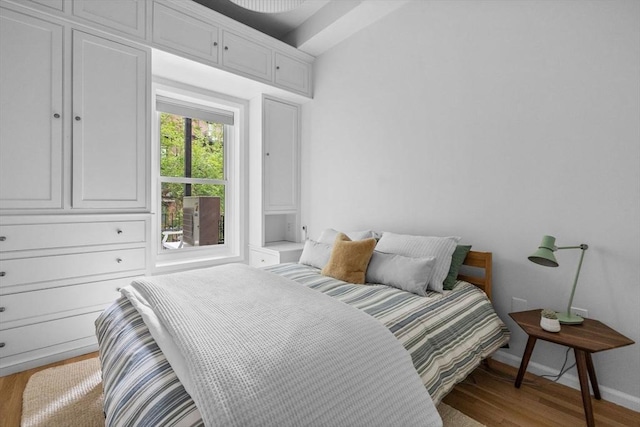 26 Concord Sq Unit 2, Boston, MA 02118 - bedroom featuring wood finished floors, baseboards, and cooling unit