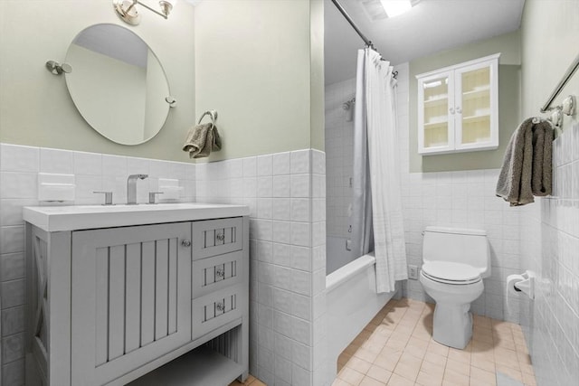 26 Concord Sq Unit 2, Boston, MA 02118 - bathroom with tile walls, toilet, vanity, shower / bath combo with shower curtain, and tile patterned flooring