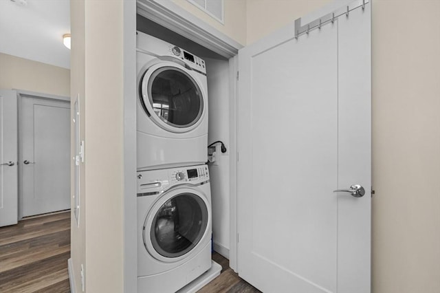 180 Telford St Unit 614, Boston, MA 02135 - washroom with stacked washing machine and dryer and dark wood-style floors