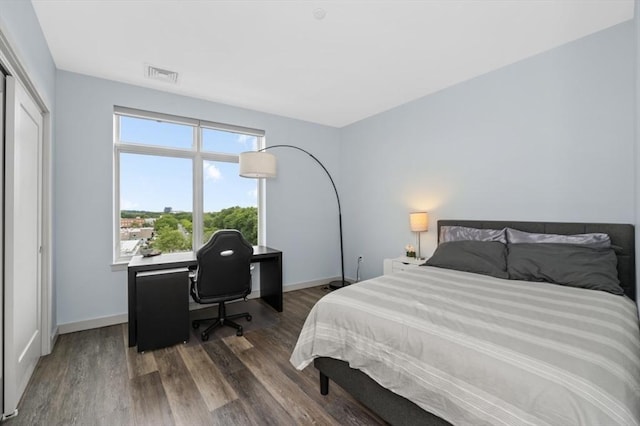 180 Telford St Unit 614, Boston, MA 02135 - bedroom featuring wood finished floors, baseboards, and a desk