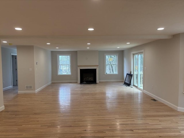 unfurnished living room featuring light hardwood / wood-style flooring