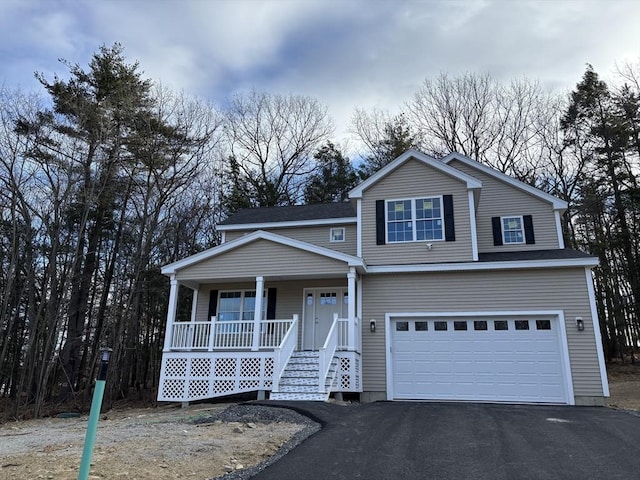 view of front property with a garage and covered porch