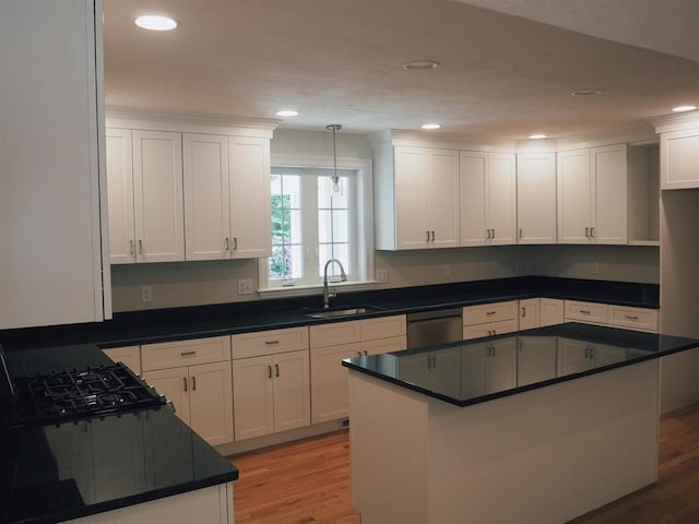 kitchen with white cabinetry and sink