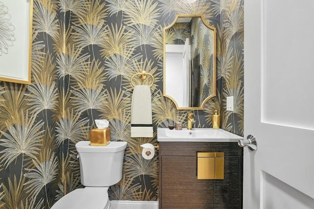 140 Main St Unit E, Amesbury, MA 01913 - half bathroom with wallpapered walls, vanity, and toilet