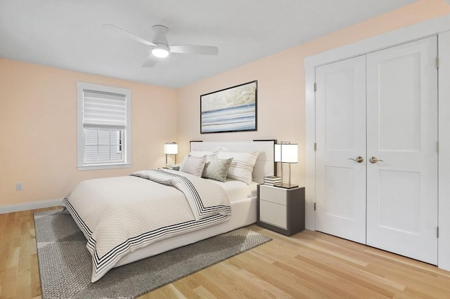 140 Main St Unit E, Amesbury, MA 01913 - bedroom with light wood-style flooring, a closet, baseboards, and ceiling fan