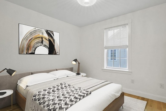 140 Main St Unit E, Amesbury, MA 01913 - bedroom with wood finished floors and baseboards