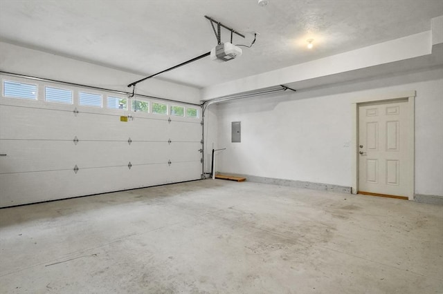 140 Main St Unit E, Amesbury, MA 01913 - garage featuring a garage door opener and electric panel