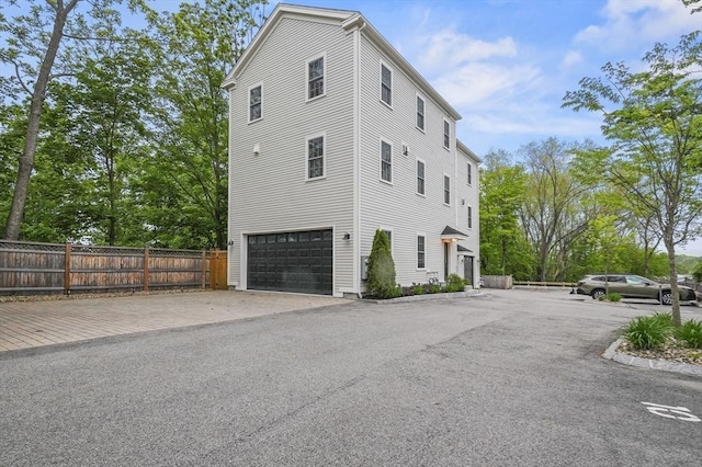 140 Main St Unit E, Amesbury, MA 01913 - view of side of home with a garage