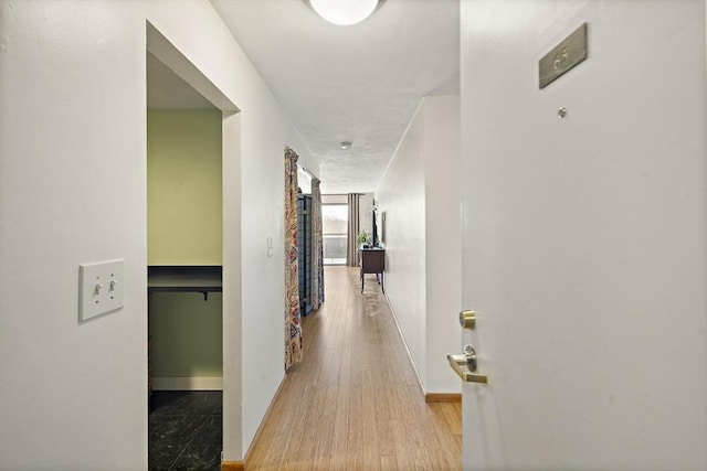 32 Whites Ave Unit D65, Watertown, MA 02472 - hallway featuring baseboards and wood finished floors