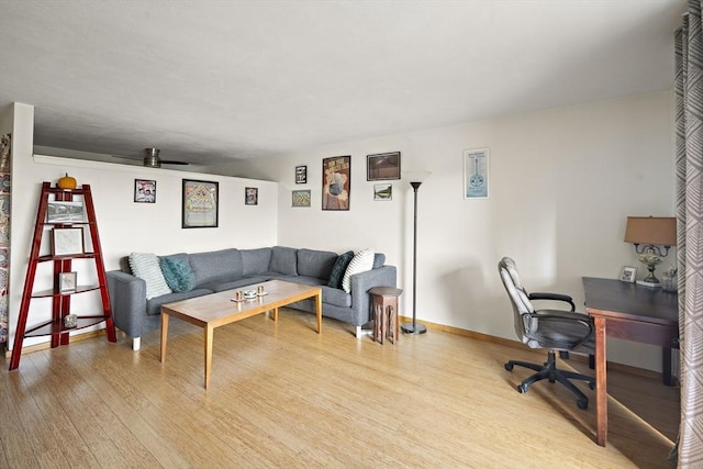 32 Whites Ave Unit D65, Watertown, MA 02472 - living area featuring light wood-type flooring, a desk, a ceiling fan, and baseboards