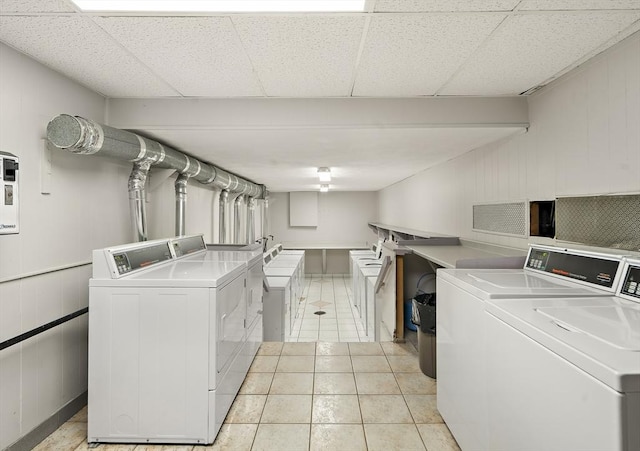 32 Whites Ave Unit D65, Watertown, MA 02472 - shared laundry featuring separate washer and dryer and light tile patterned floors