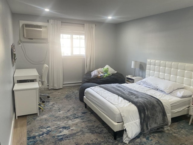 200 Manning St Unit 17C, Hudson, MA 01749 - bedroom with a wall mounted AC, wood finished floors, and recessed lighting