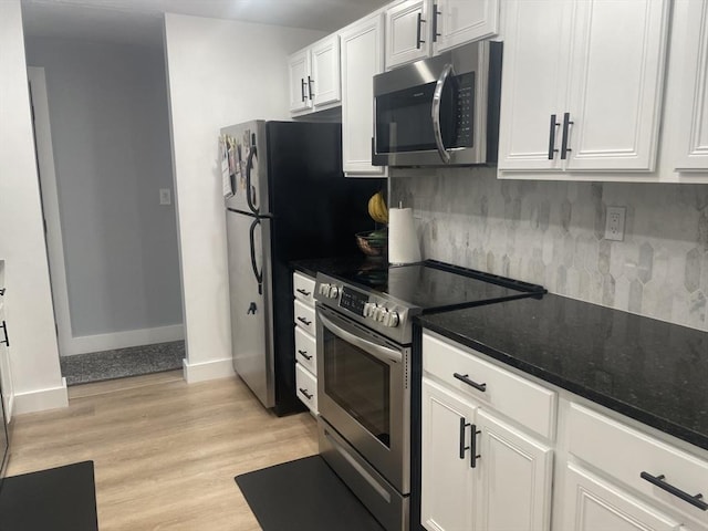 200 Manning St Unit 17C, Hudson, MA 01749 - kitchen featuring stainless steel appliances, tasteful backsplash, white cabinetry, and light wood-type flooring