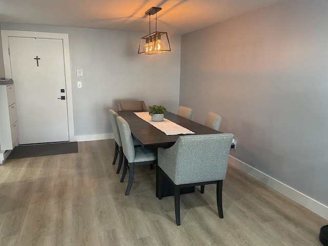 200 Manning St Unit 17C, Hudson, MA 01749 - dining room featuring wood finished floors and baseboards