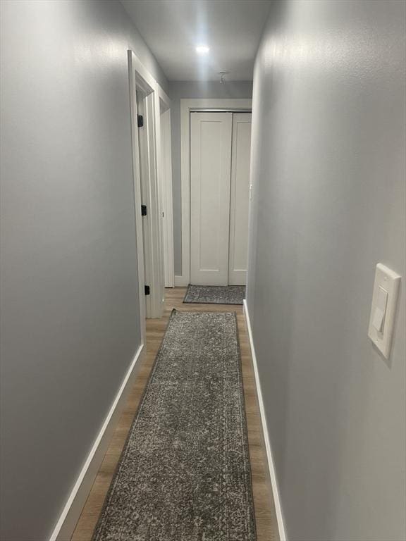 200 Manning St Unit 17C, Hudson, MA 01749 - hallway featuring baseboards and dark wood-style floors