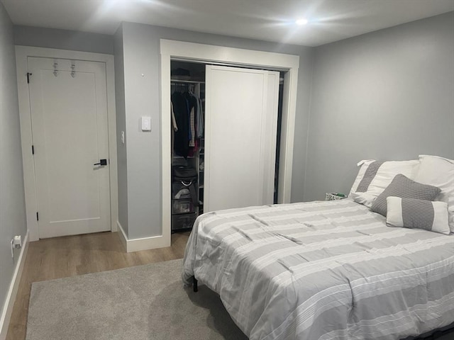 200 Manning St Unit 17C, Hudson, MA 01749 - bedroom with wood finished floors, a closet, and baseboards