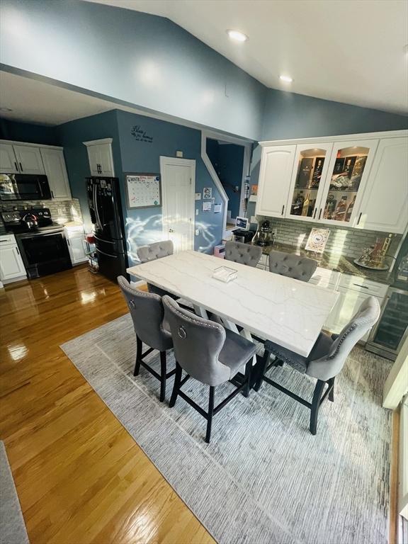 15 Bates Rd, Framingham, MA 01702 - dining room featuring lofted ceiling, recessed lighting, and wood finished floors