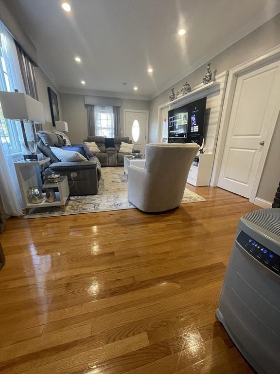 15 Bates Rd, Framingham, MA 01702 - living area with ornamental molding, recessed lighting, and wood finished floors