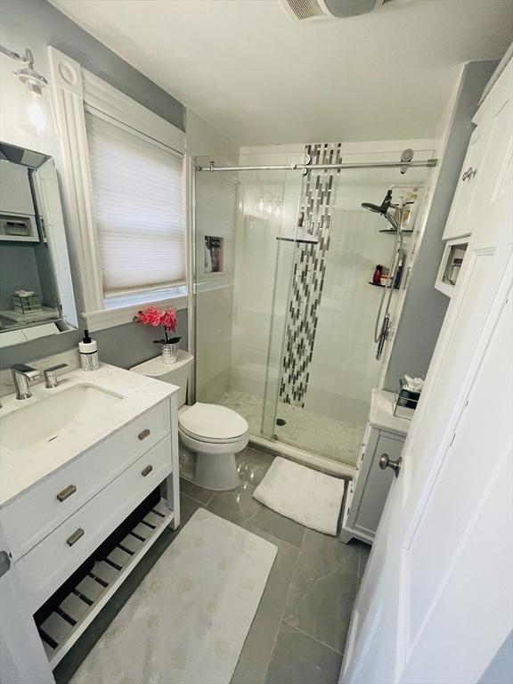 15 Bates Rd, Framingham, MA 01702 - full bath with vanity, toilet, and a stall shower