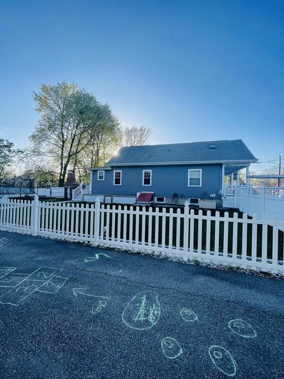15 Bates Rd, Framingham, MA 01702 - view of front of house featuring a fenced front yard