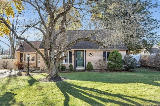 ranch-style house with a front lawn