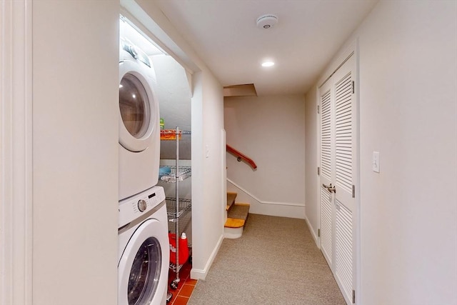 laundry room with stacked washer / drying machine, recessed lighting, laundry area, baseboards, and carpet floors