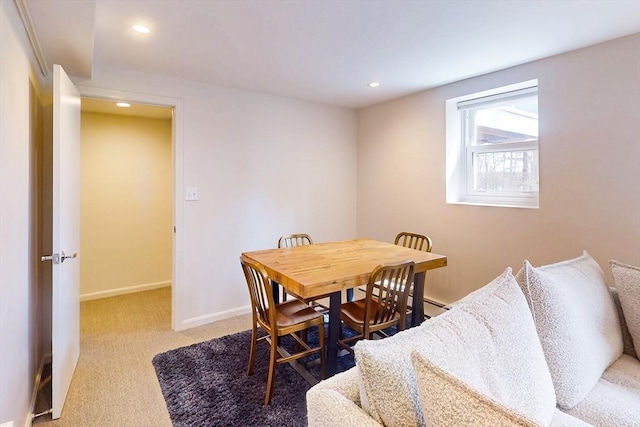 dining area featuring recessed lighting, light colored carpet, and baseboards
