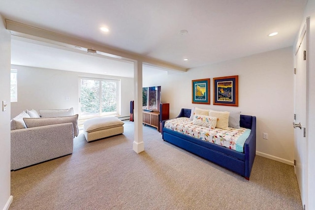 carpeted bedroom with a baseboard heating unit, recessed lighting, and baseboards