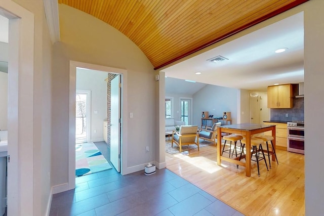 dining space with recessed lighting, wooden ceiling, vaulted ceiling, baseboards, and visible vents
